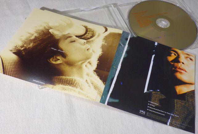 (この写真ではよくわからないが)このころは、どアフロの髪型であり、アメリカ指向?